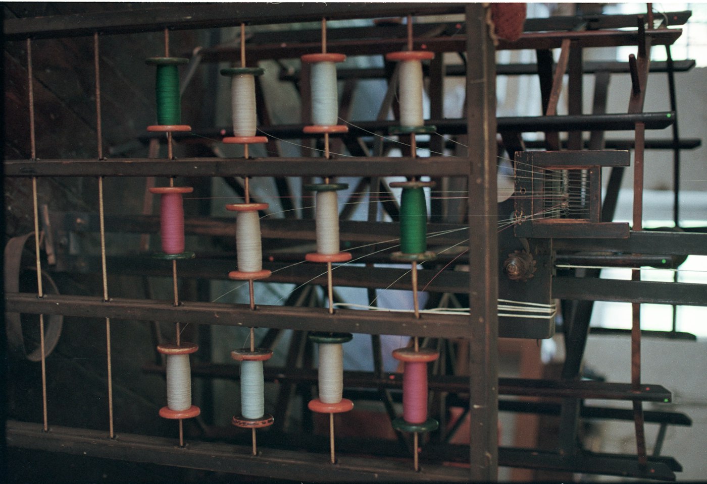 Rack of thread spools in the Sri Vinayaga production unit