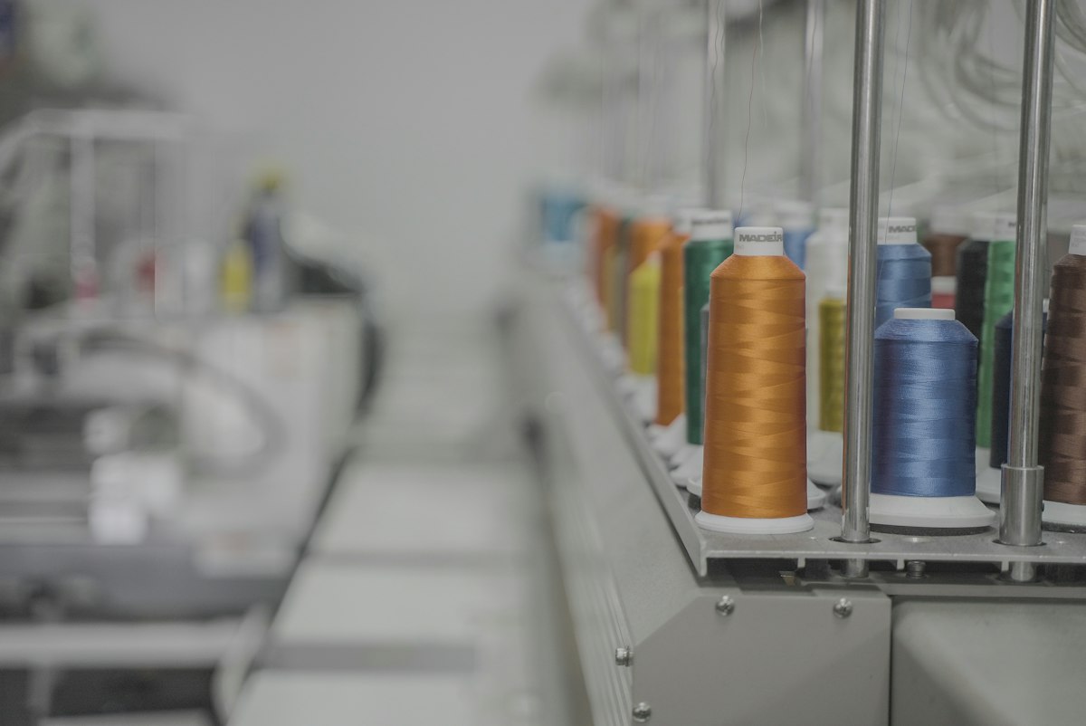 Thread spools loaded on an industrial sewing machine