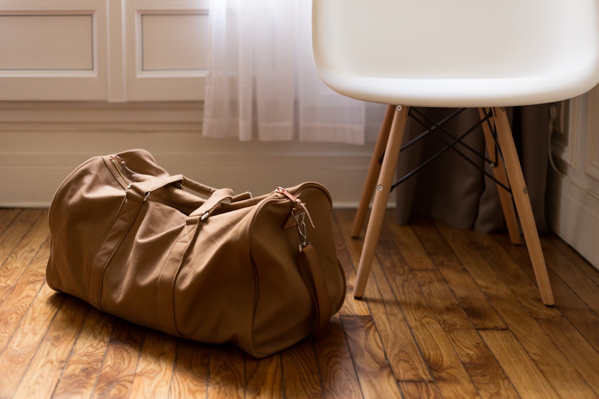 Duffel gym bag with a wide carry strap