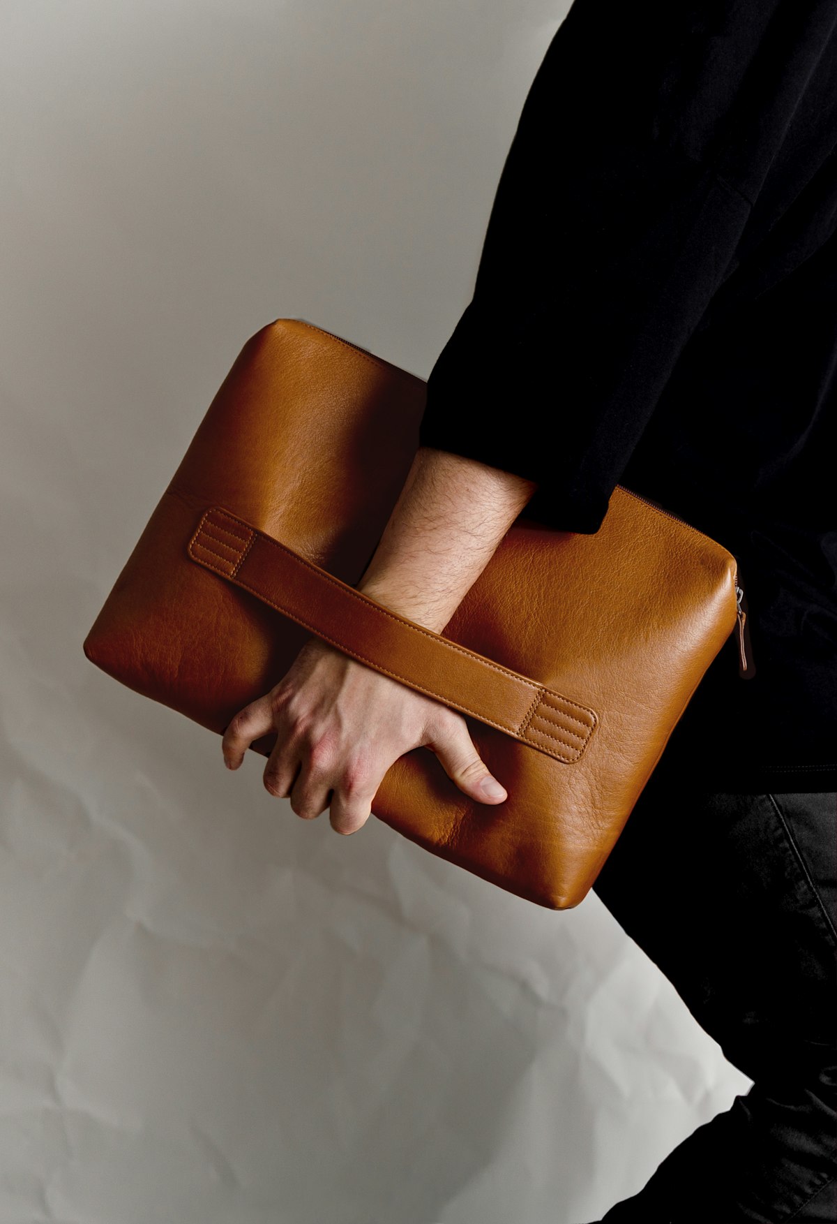 Leather briefcase carried by hand